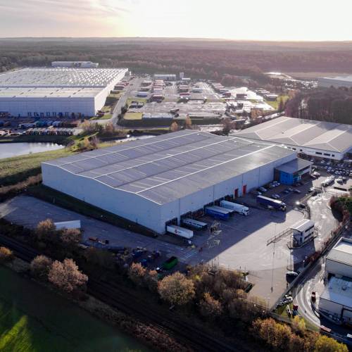 A drone photo of Hancocks' warehouse in Sutton. Trucks can be seen in the loading=